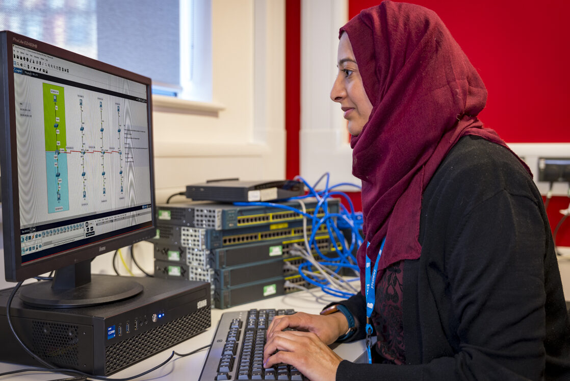 an image of a female computing student sat at a monitor