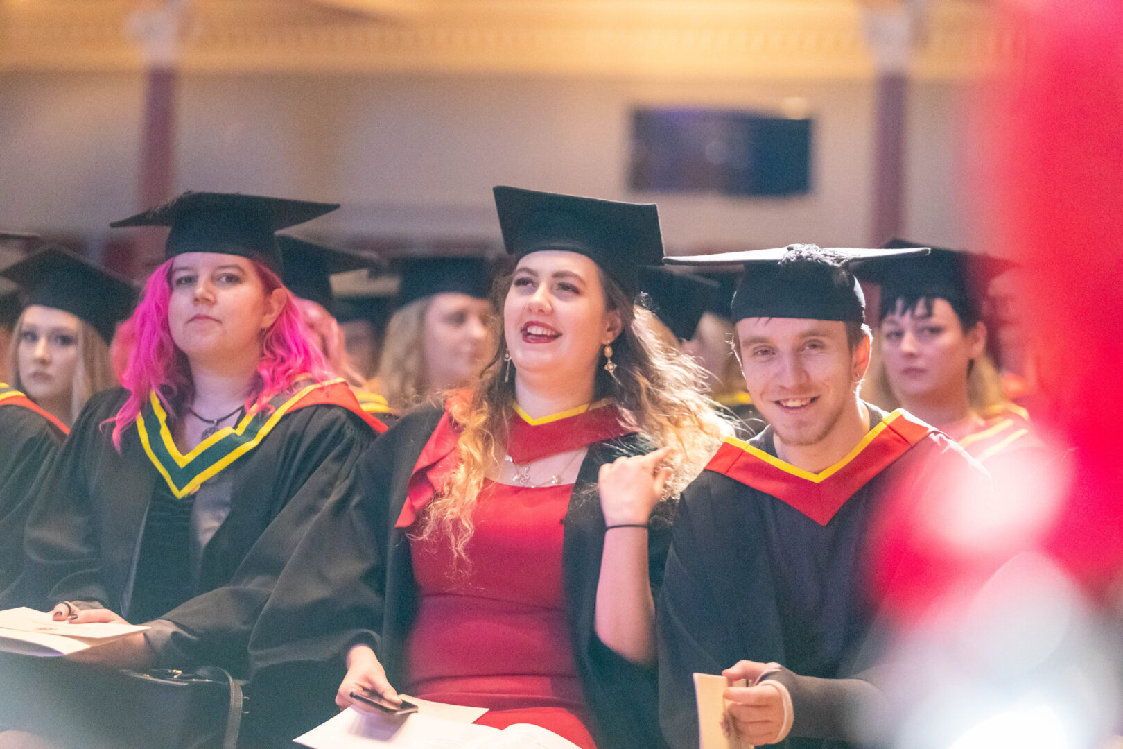 a smiling group of graduates