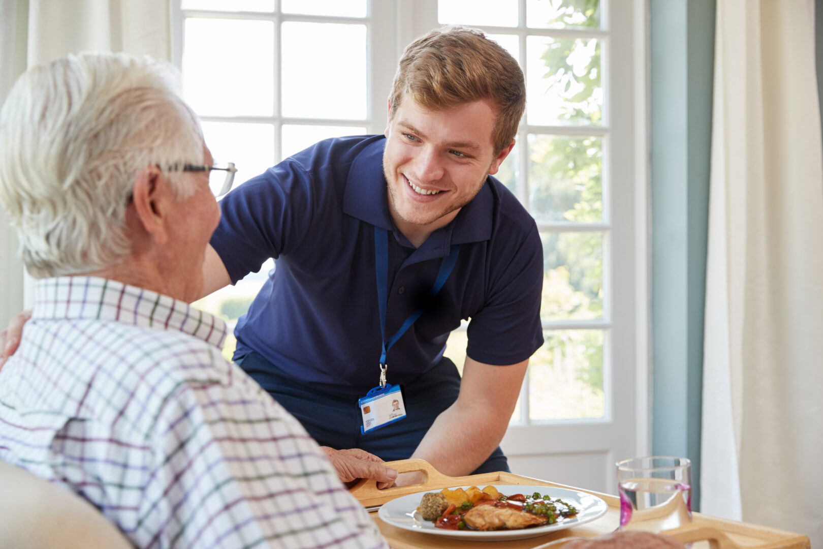 a healthcare student caring for an elderly patient