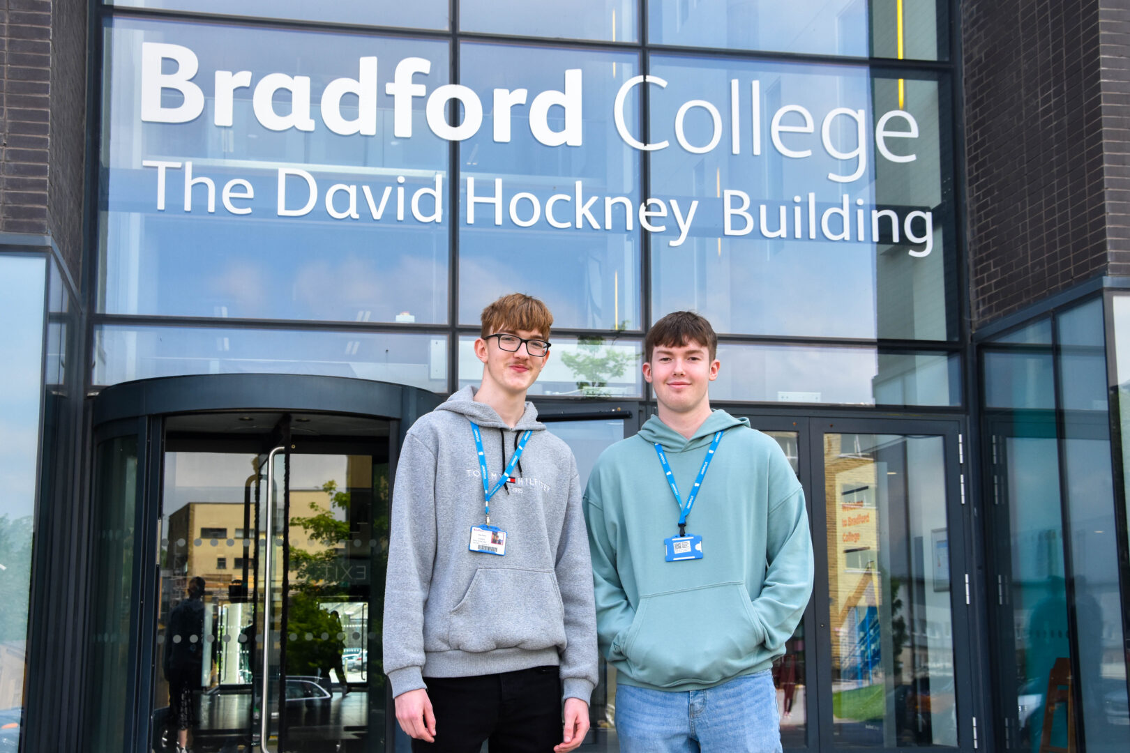 two bradford college students stand outside of the david hockney building