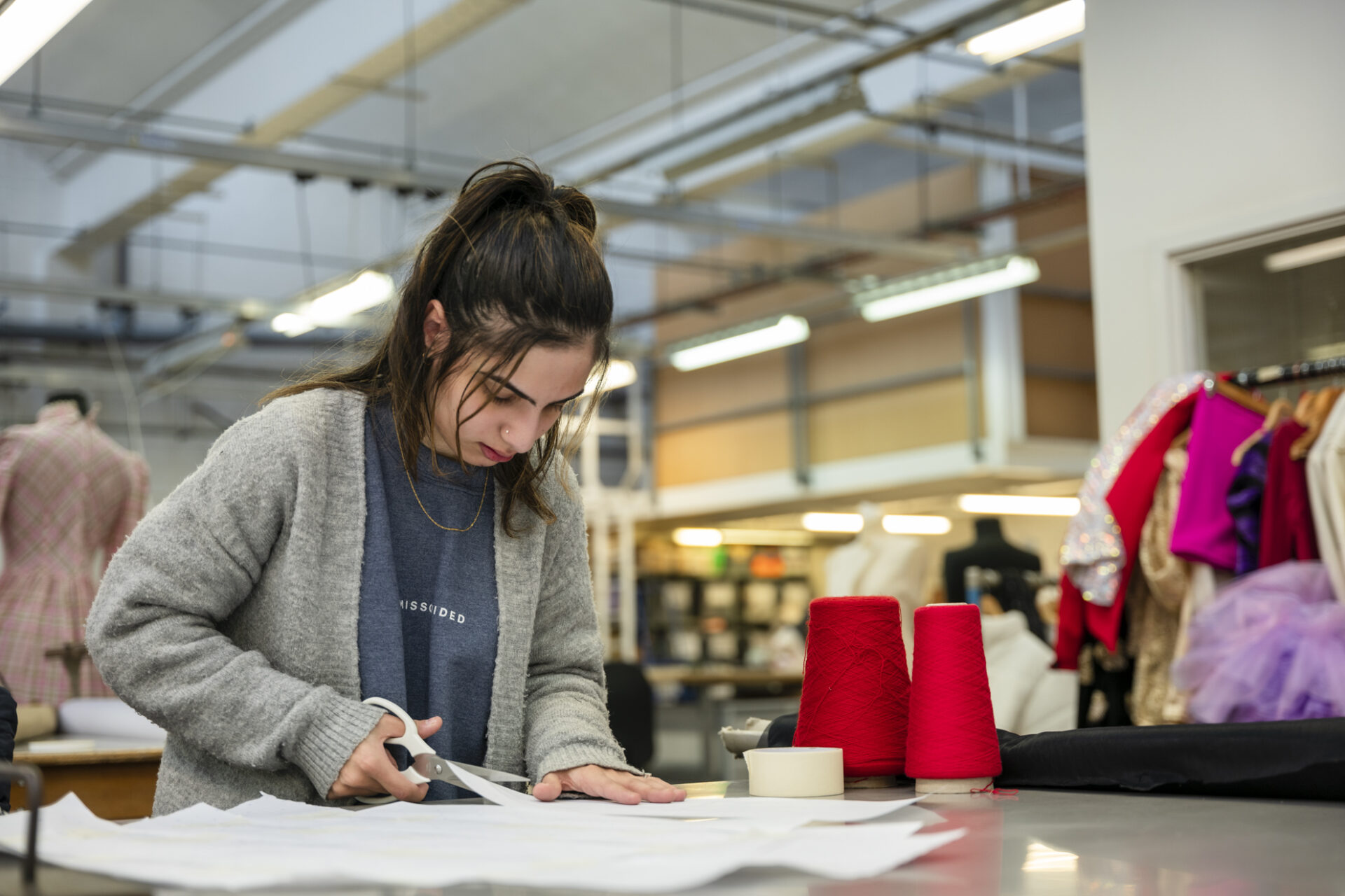 a student sits in the fashion studio