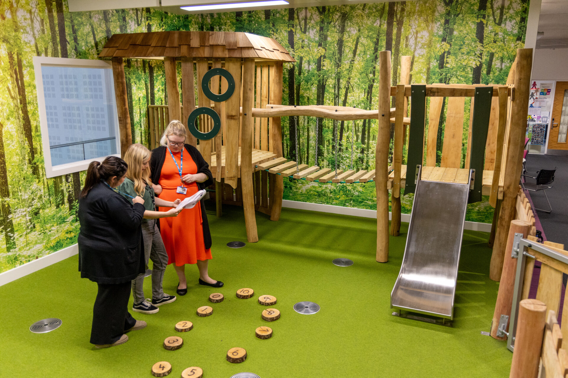 Female tutor with female students in our mock outdoor nursery facilities