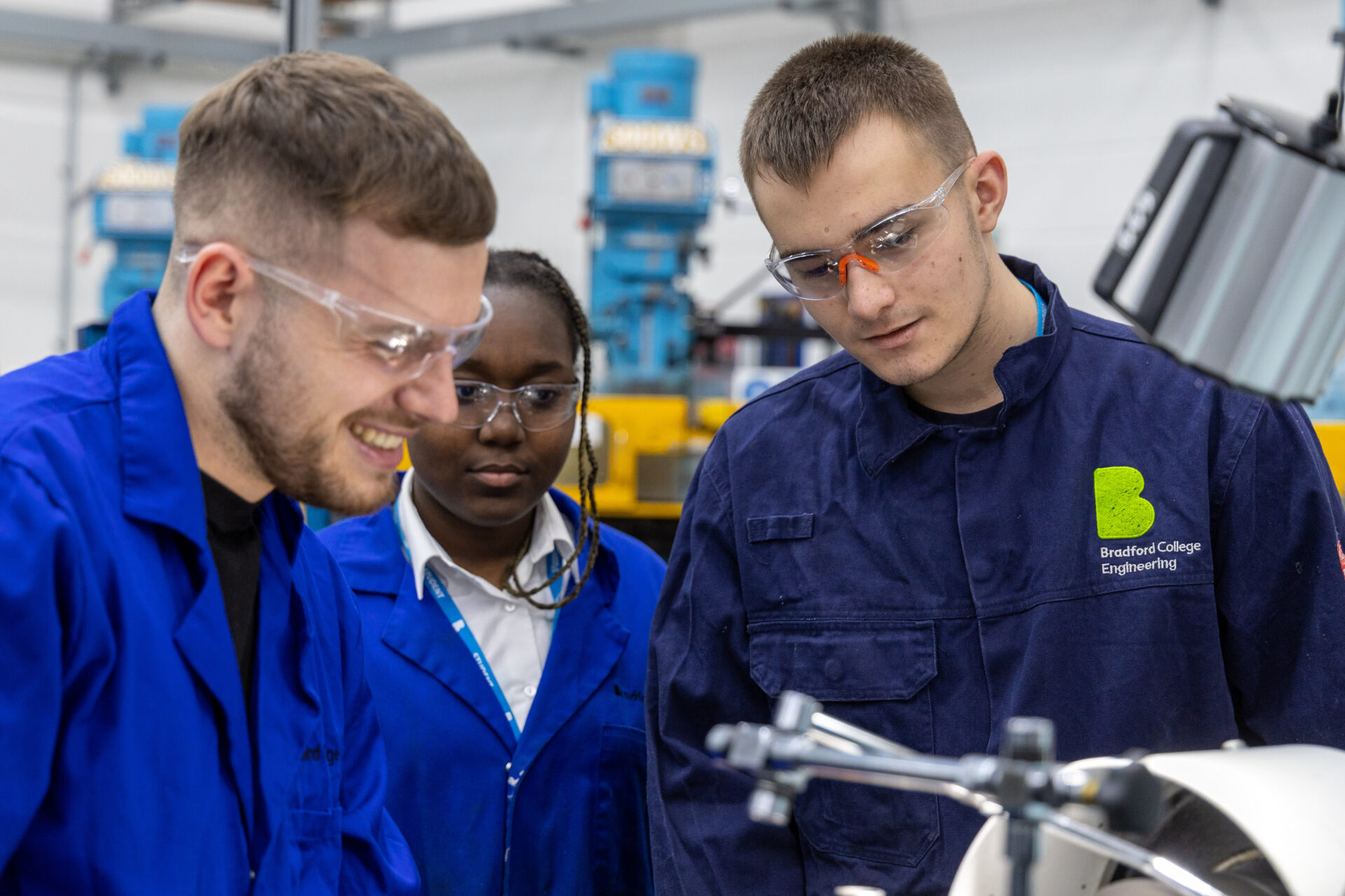 Male tutor with female and male student in our engineering facilities