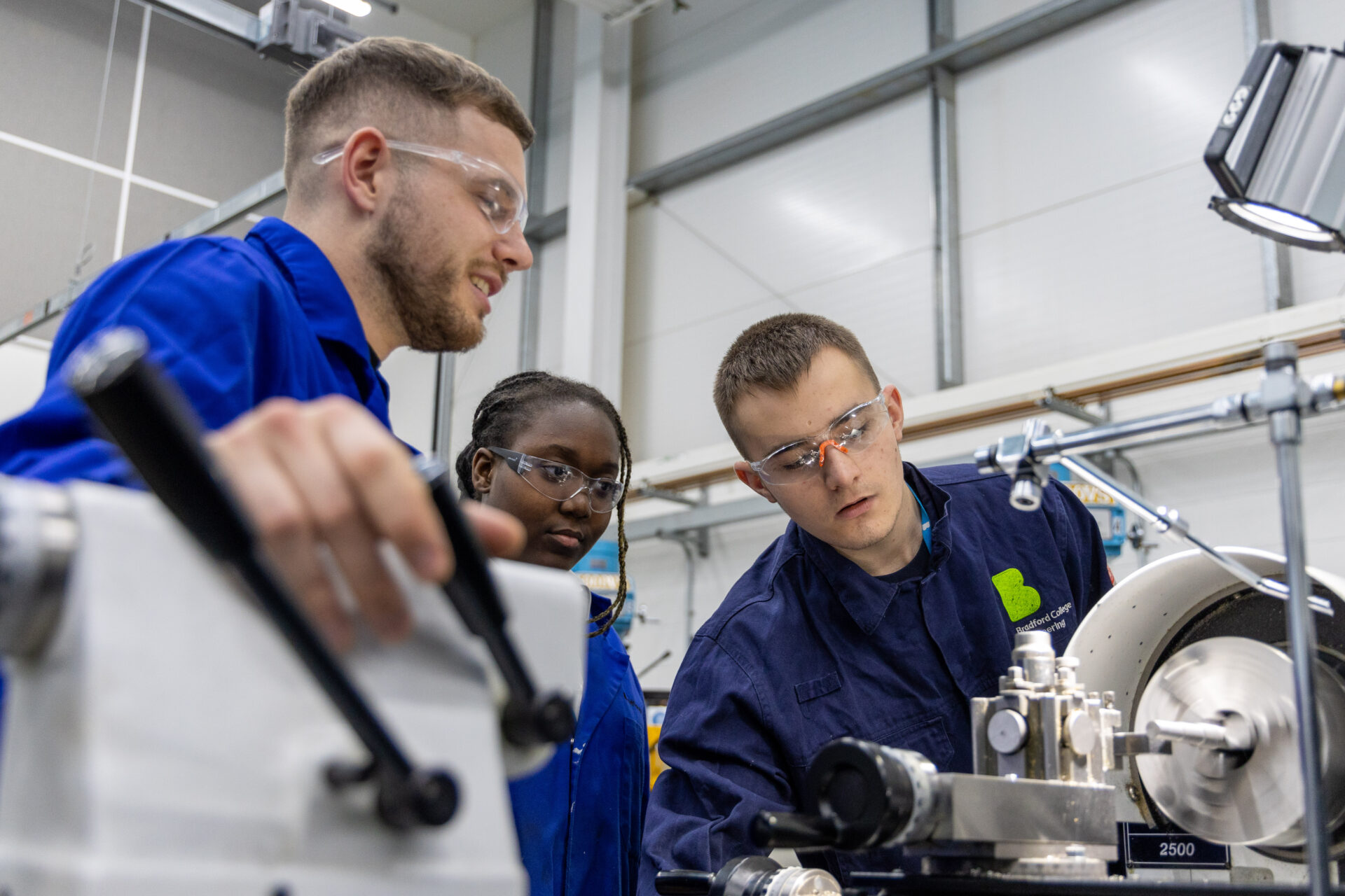 Male tutor with female and male student in our engineering facilities