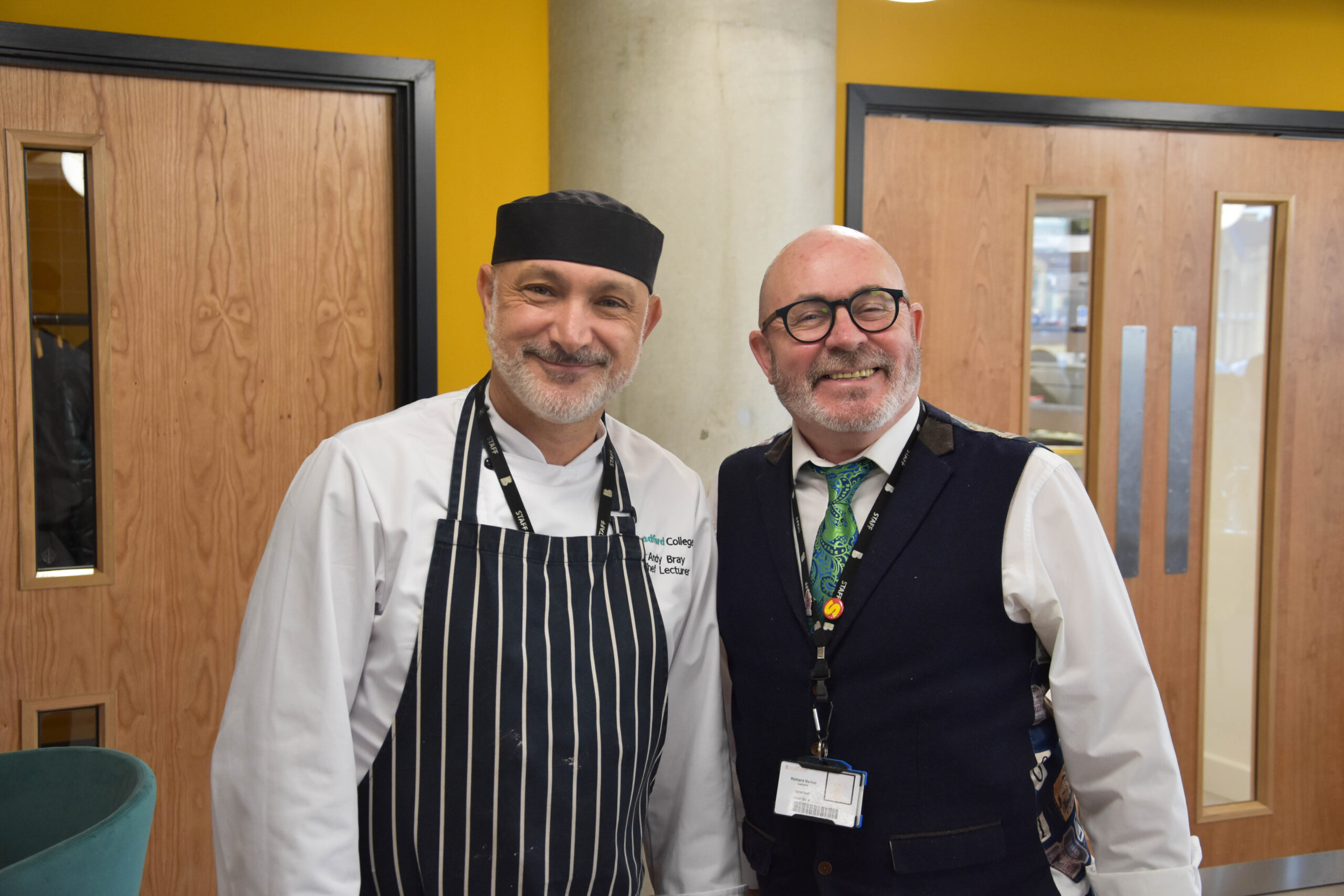 a chef and the restaurant manager smiling