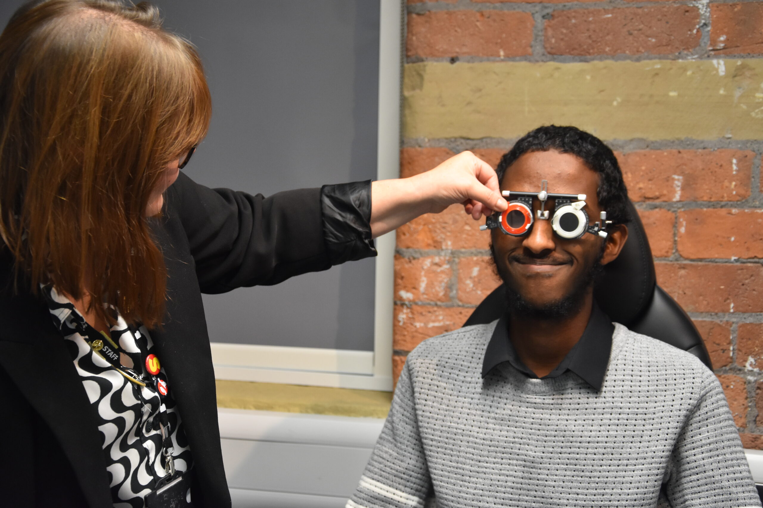 Ophthalmic students getting eye tests